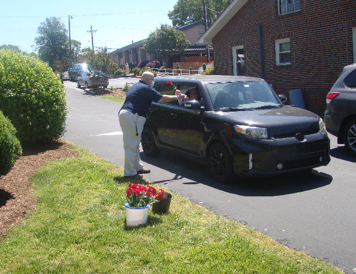 Bryan Clark giving out Rose for Mother's Day